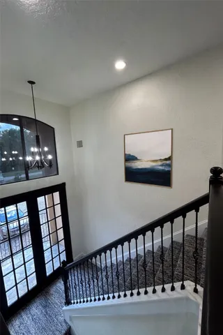 a view of a garden with flowers and trees