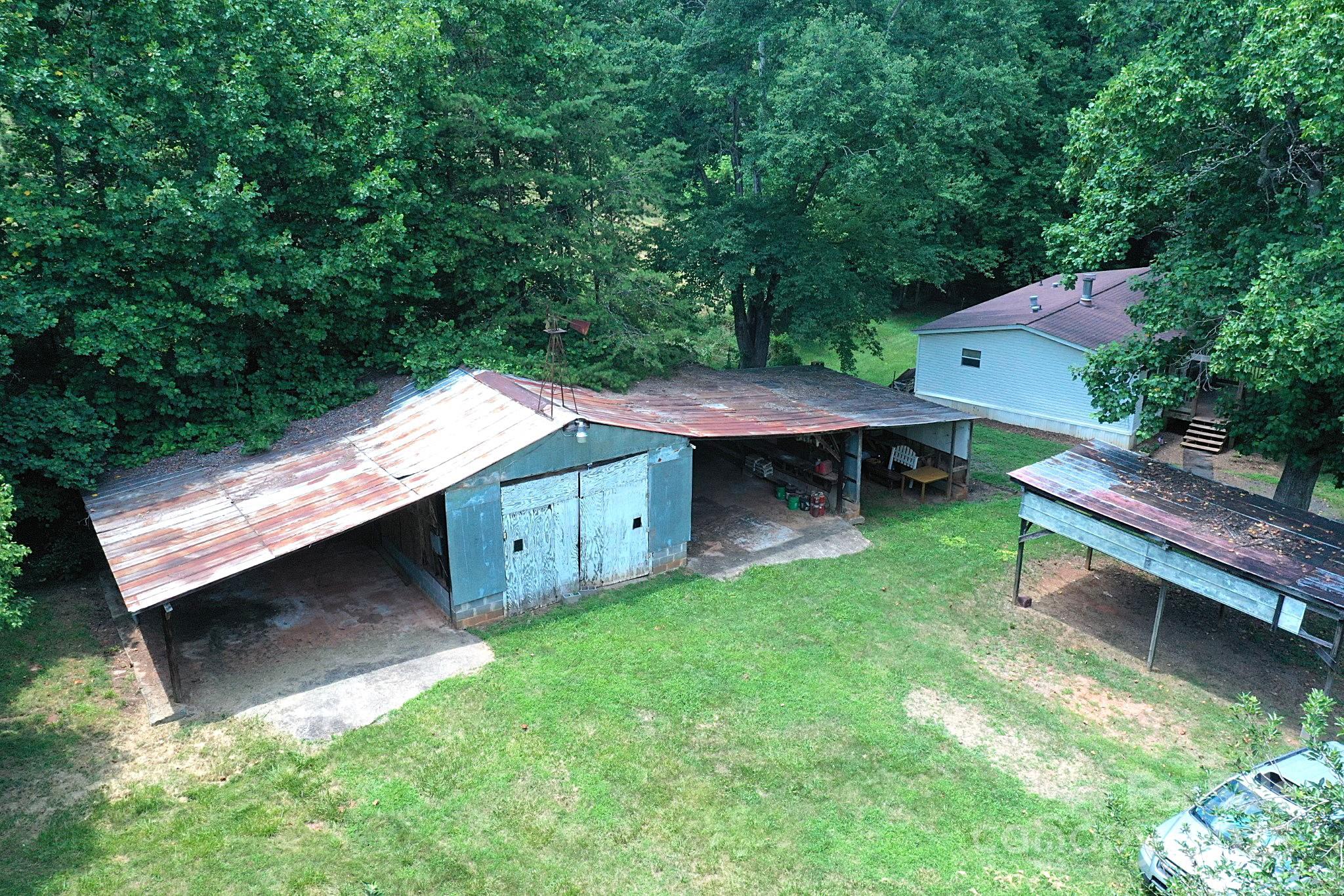 4171 Leatherman Road Vale, NC 28168 - Photo 12 of 24 a backyard of a house with table and chairs
