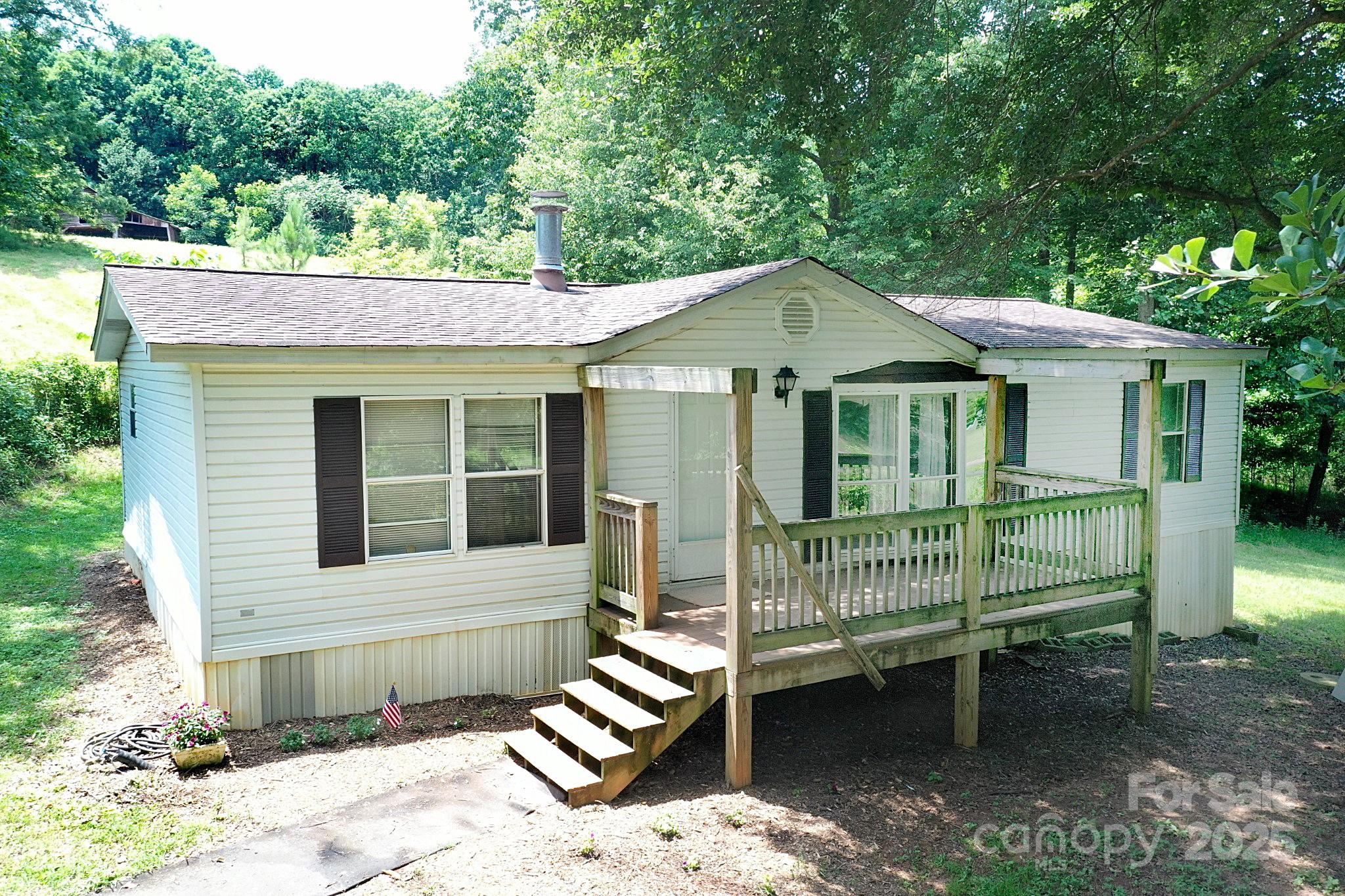 4171 Leatherman Road Vale, NC 28168 - Photo 13 of 24 a front view of a house with a garden