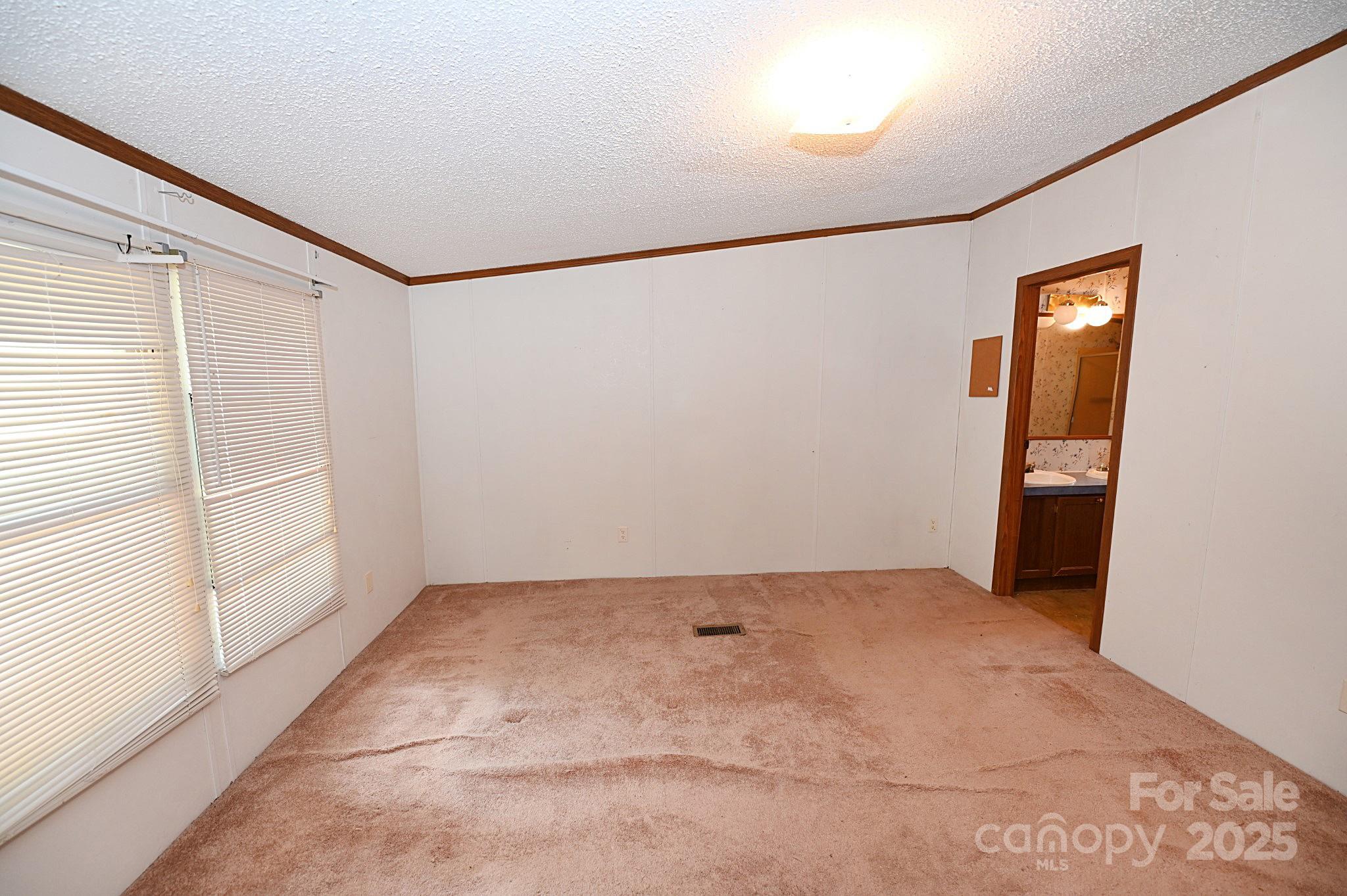 4171 Leatherman Road Vale, NC 28168 - Photo 22 of 24 an empty room with windows