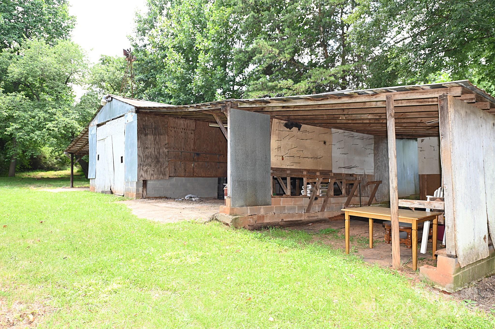 4171 Leatherman Road Vale, NC 28168 - Photo 24 of 24 a view of a chair and table in backyard of the house