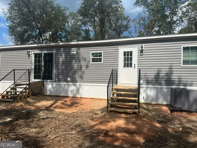 a view of kitchen with stainless steel appliances granite countertop a stove and a refrigerator