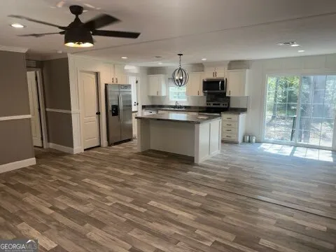 a view of an empty room and a window