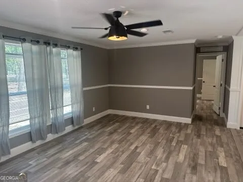 a kitchen with kitchen island granite countertop a stove and a sink
