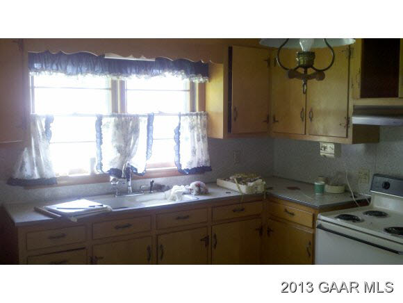 2080 Lyndhurst Road Waynesboro, VA 22980 - Photo 5 of 9 a kitchen with a sink a window and cabinets