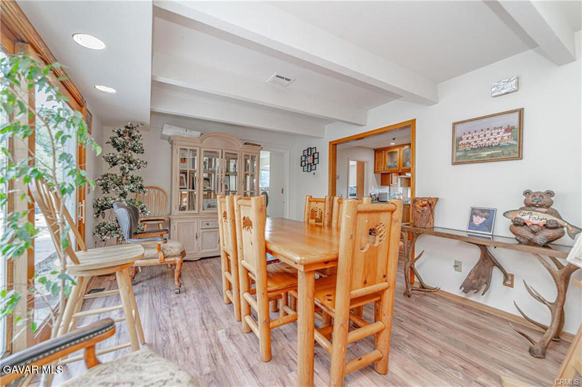 43155 Lake Hughes Road Lake Hughes, CA 93532 - Photo 11 of 37 a view of a livingroom with furniture wooden floor and a book shelf