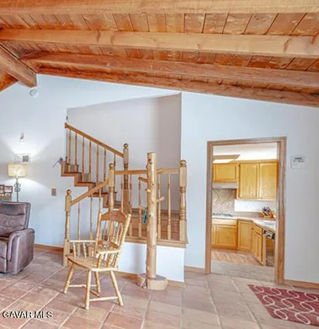 a view of a room with table and chairs
