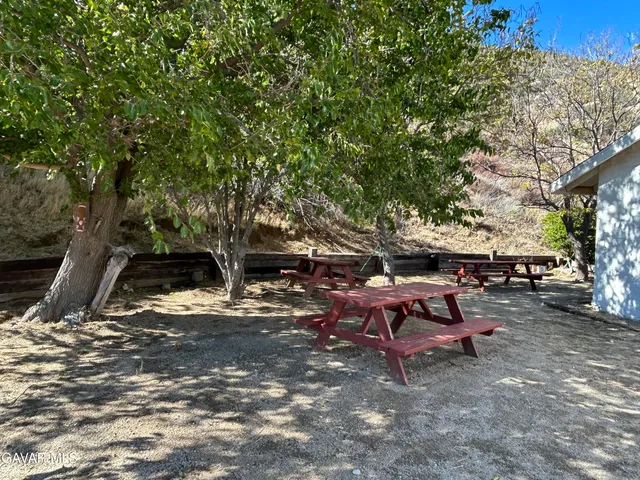 a view of a backyard with sitting area