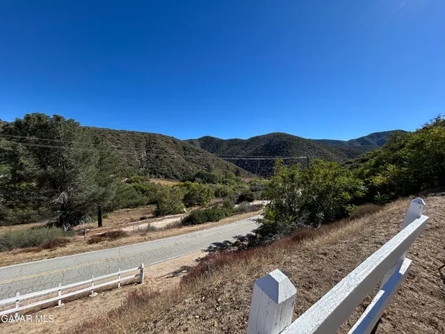 a view of a backyard of a house