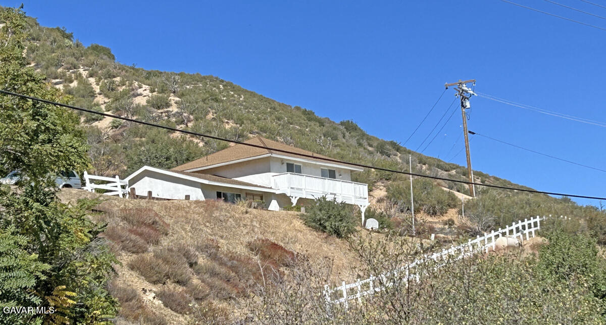 43155 Lake Hughes Road Lake Hughes, CA 93532 - Photo 4 of 37 a view of a house with a yard