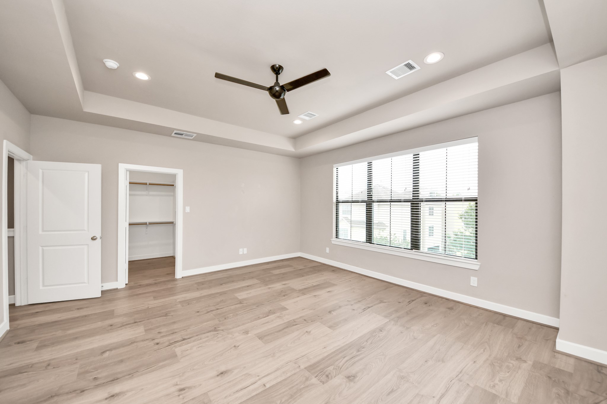 2114 Stuart Street Houston, TX 77004 - Photo 5 of 39 a view of an empty room with wooden floor and a window