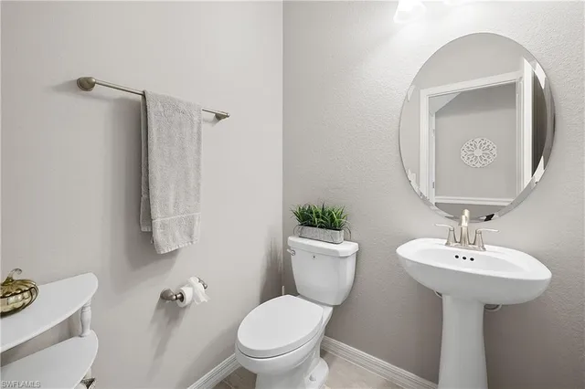 a bedroom with furniture and a chair