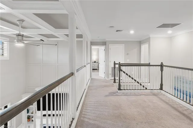 a spacious bedroom with a bed and large windows