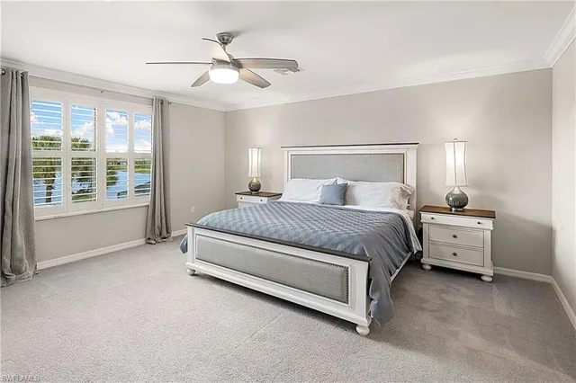 a bathroom with a granite countertop sink a large mirror a bathtub and next to a window