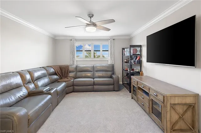 an aerial view of a house with a garden and lake view