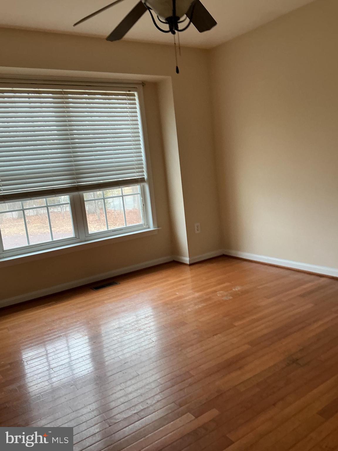 205 Freedom Road Locust Grove, VA 22508 - Photo 17 of 29 a view of an empty room with wooden floor and a window