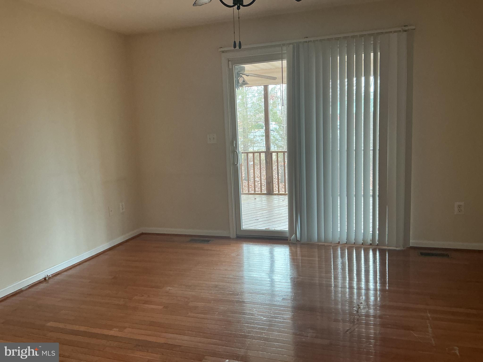 205 Freedom Road Locust Grove, VA 22508 - Photo 20 of 29 a view of an empty room with wooden floor and a window