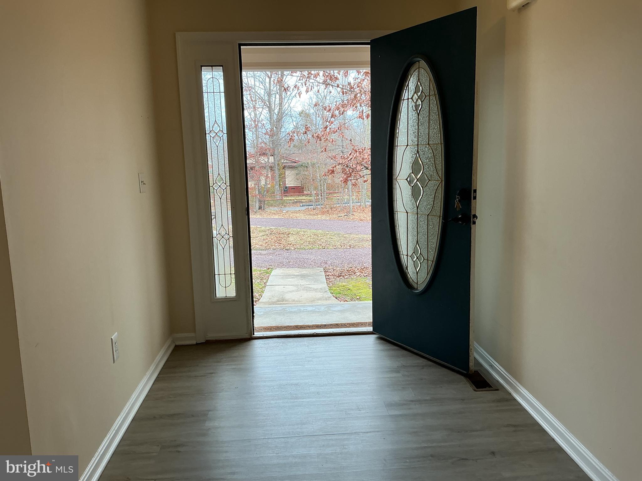 205 Freedom Road Locust Grove, VA 22508 - Photo 25 of 29 an empty room with wooden floor and windows