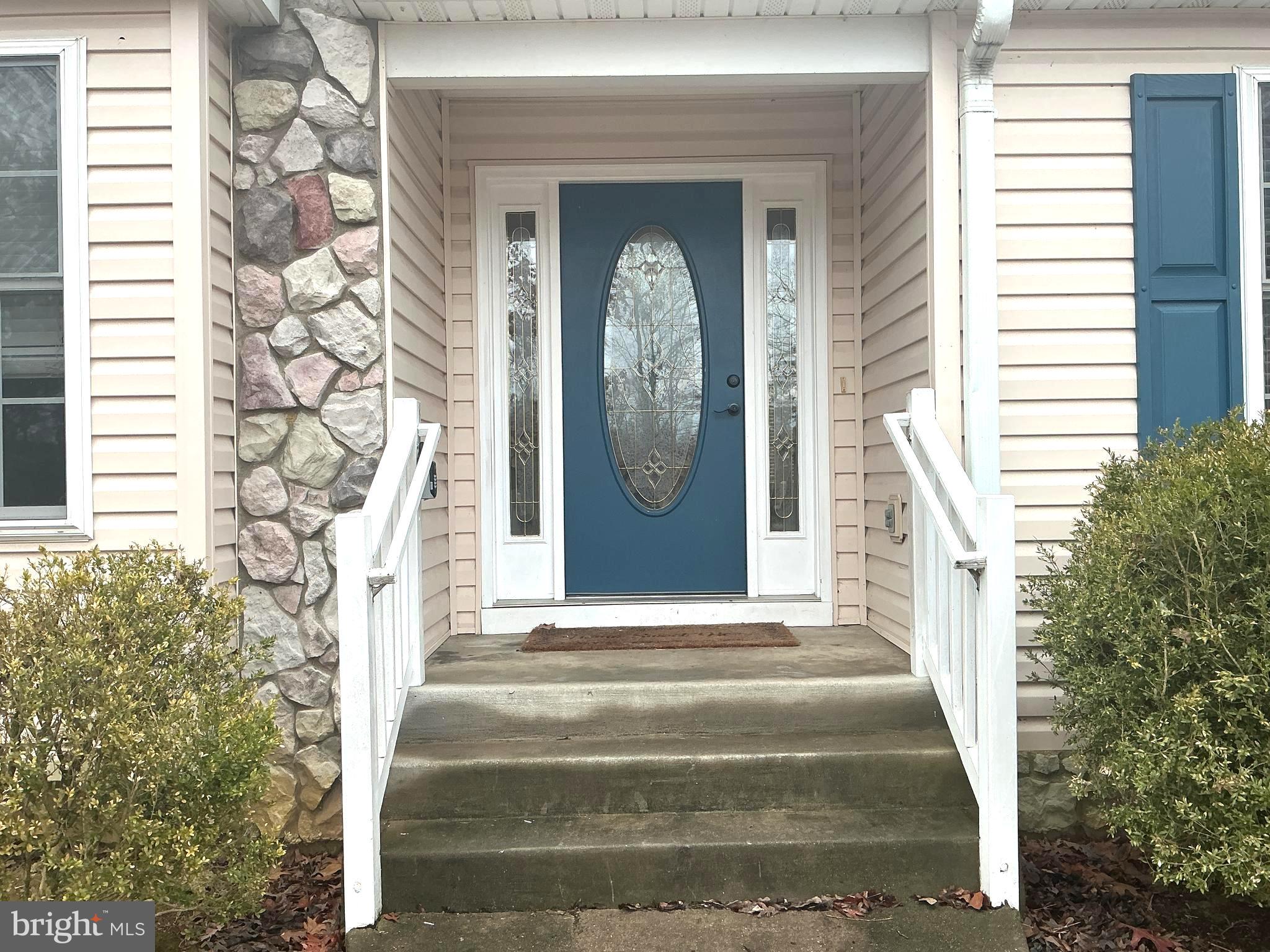 205 Freedom Road Locust Grove, VA 22508 - Photo 3 of 29 a front view of a house with a garden