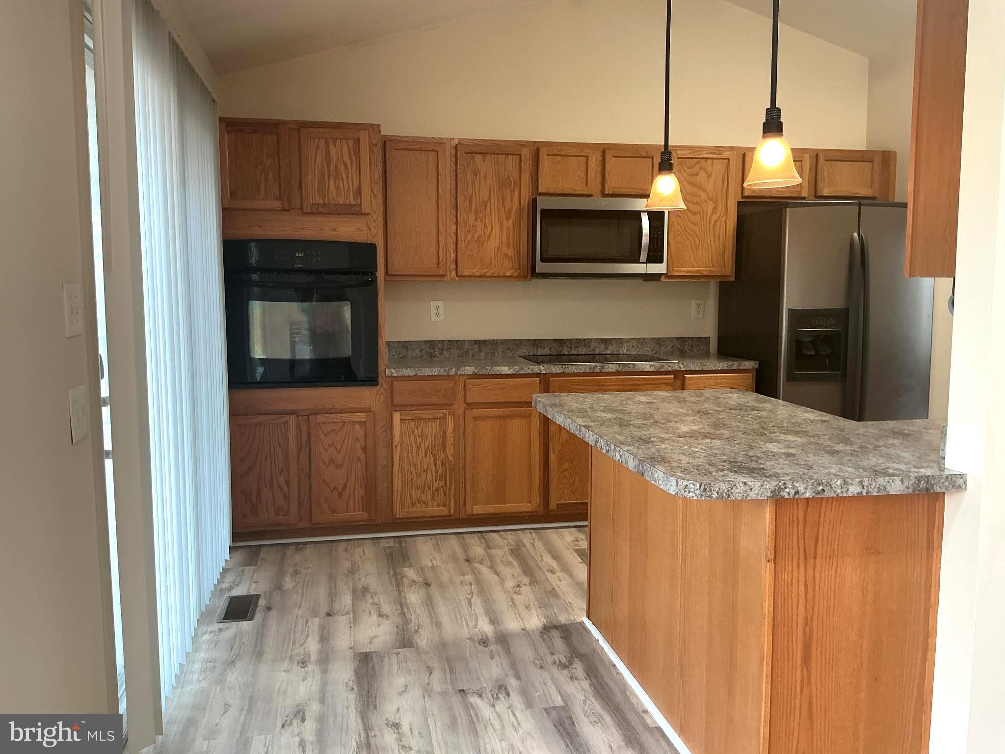 205 Freedom Road Locust Grove, VA 22508 - Photo 8 of 29 a kitchen with stainless steel appliances granite countertop a refrigerator and a stove top oven