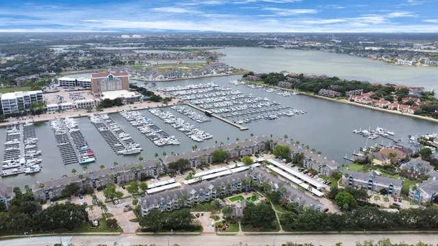 a living room with patio furniture and a flat screen tv
