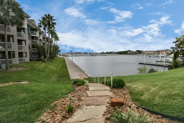 a swimming pool with outdoor seating and yard