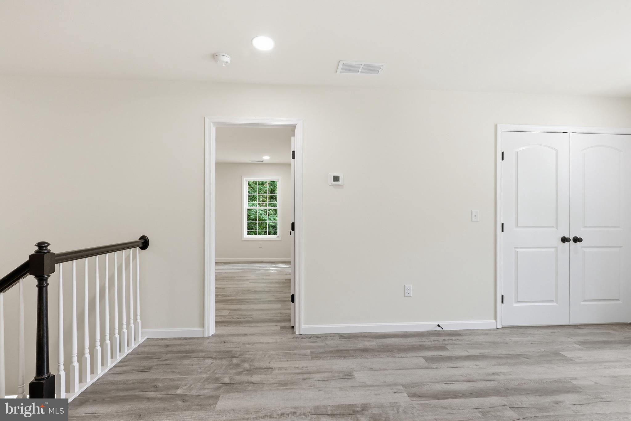 1354 College Road Dover, DE 19904 - Photo 23 of 46 a view of a hallway with wooden floor
