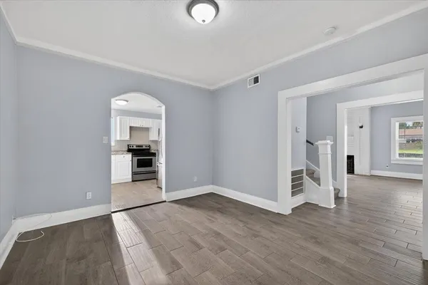 a view of washer and dryer with wooden floor