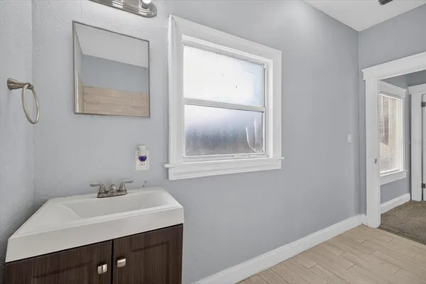 a view of an empty room with a window