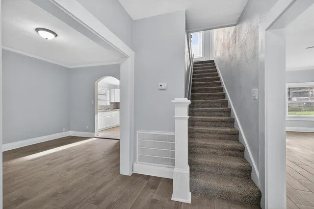 a kitchen with a refrigerator and a stove top oven