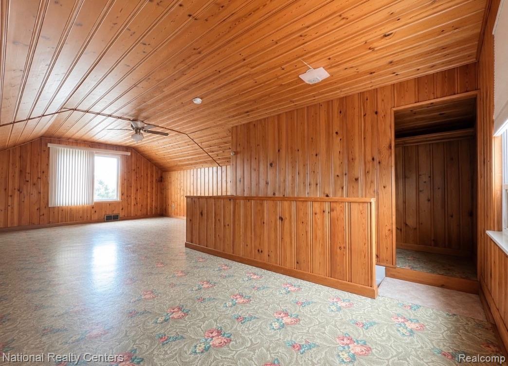 7285 Helen Street Center Line, MI 48015 - Photo 21 of 32 Spacious room featuring extensive wood paneling on walls and ceiling