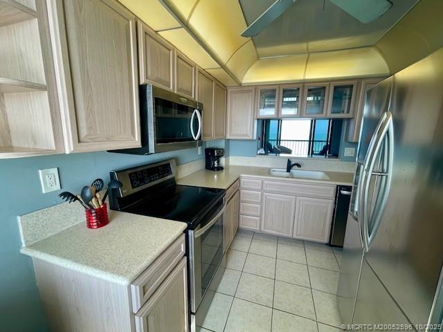 10680 South Ocean Drive, Unit 1005 Jensen Beach, FL 34957 - Photo 14 of 42 a kitchen that has a sink and a stove top oven