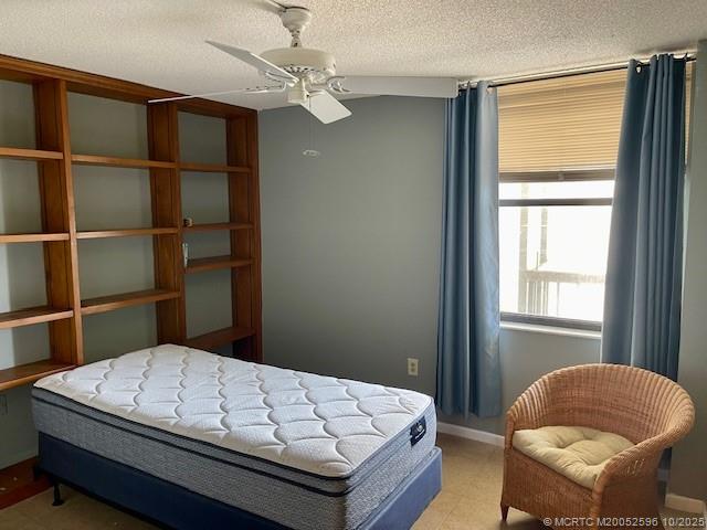 10680 South Ocean Drive, Unit 1005 Jensen Beach, FL 34957 - Photo 21 of 42 a bedroom with a bed and chair