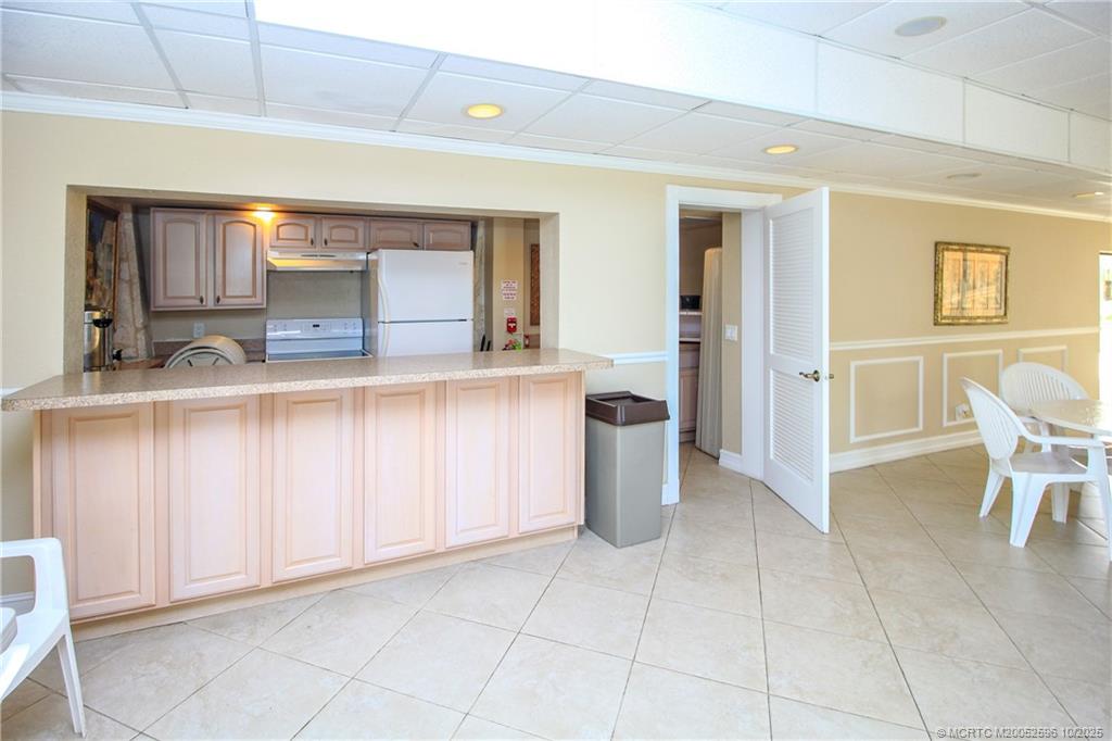 10680 South Ocean Drive, Unit 1005 Jensen Beach, FL 34957 - Photo 30 of 42 a view of a kitchen with furniture and a kitchen