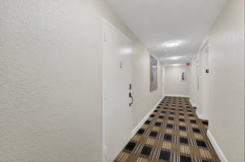 a very nice looking living room with furniture and a large window