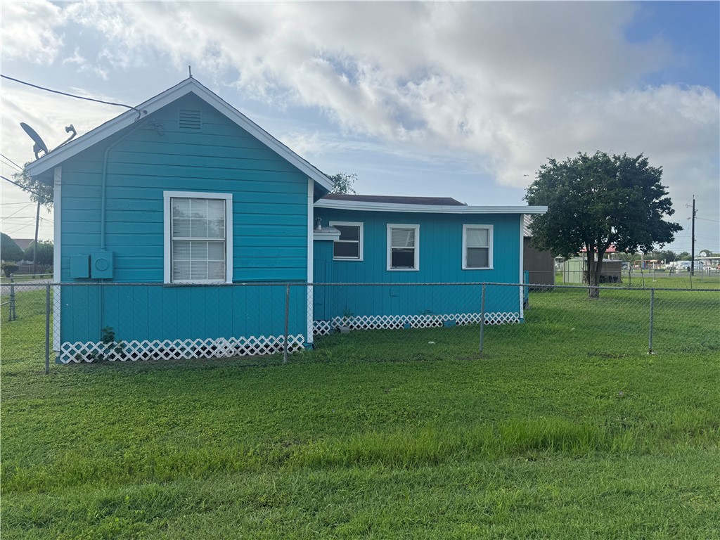 207 Franklin Gregory, TX 78359 - Photo 3 of 5 a view of a backyard with potted plants and large tree