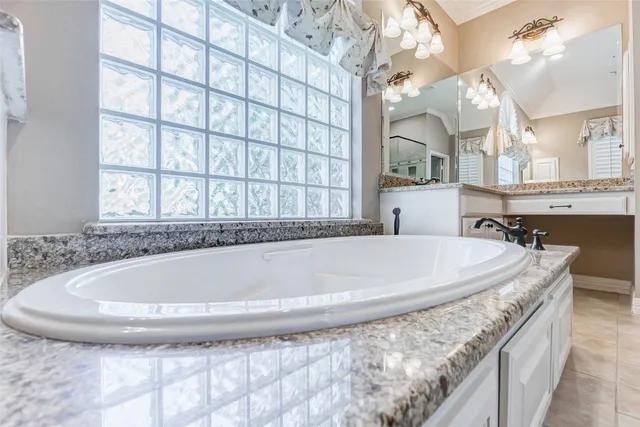 a bath tub sitting in a bathroom and sink