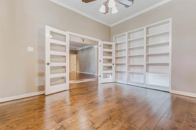 a view of room with wooden floor and closet