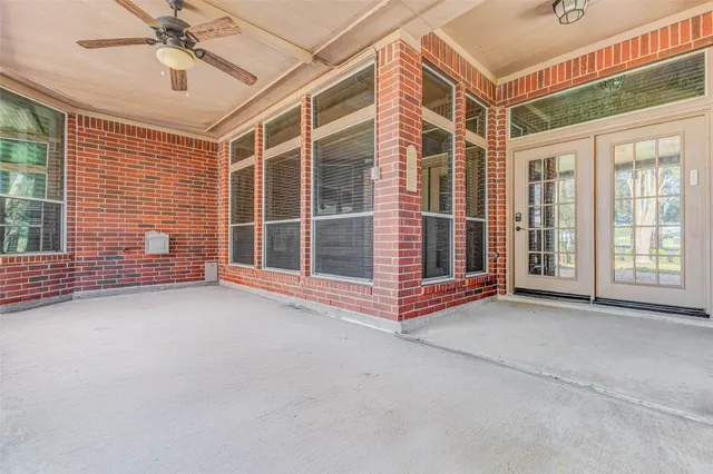 a view of an empty room with a windows