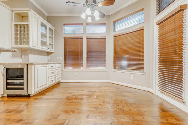 a view of a kitchen with stainless steel appliances and cabinets