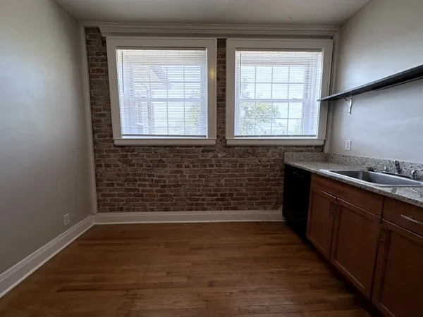 a kitchen with a sink and a window