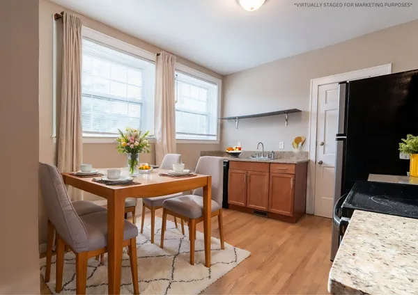 a kitchen with a table and chairs in it
