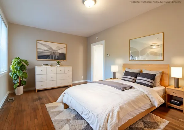 a bedroom with a bed and a dresser