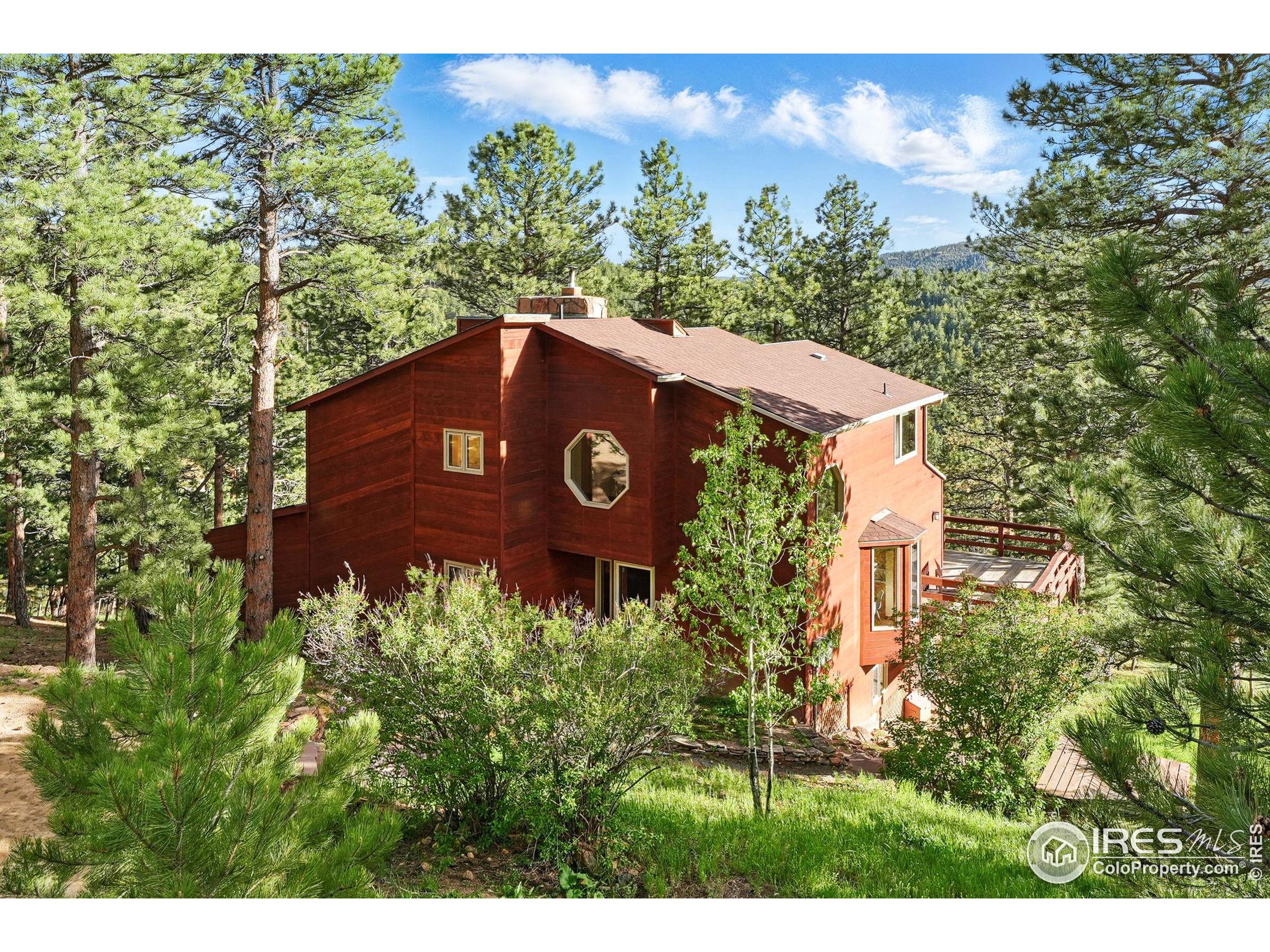 1101 Peakview Circle Boulder, CO 80302 - Photo 15 of 37 a view of a tree with a building in front of it