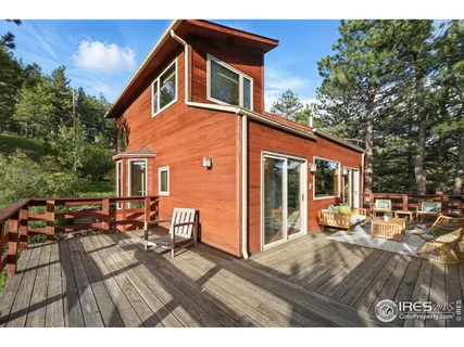 a view of sitting area with furniture in backyard