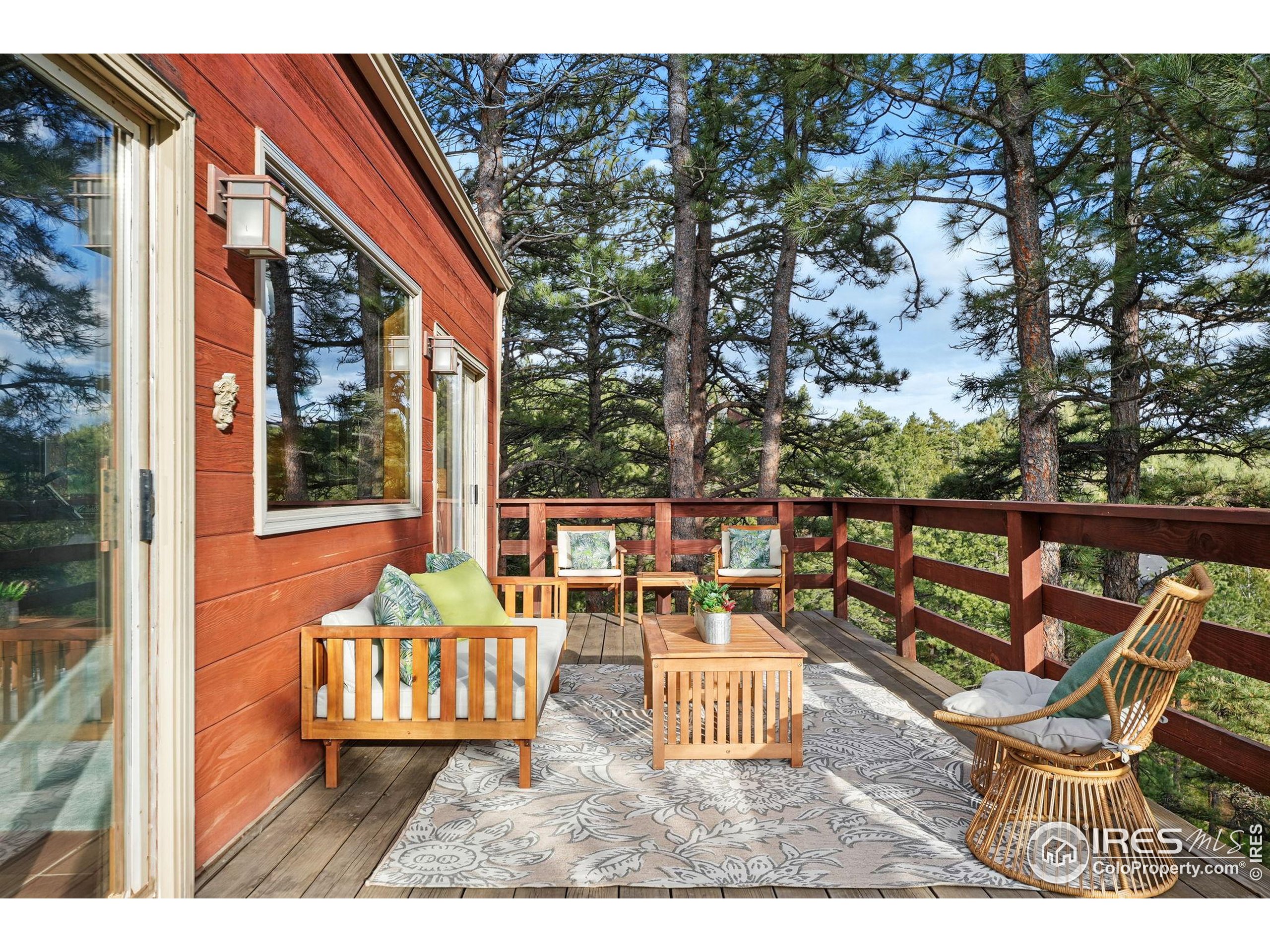 1101 Peakview Circle Boulder, CO 80302 - Photo 19 of 37 a view of a chairs and table on the deck