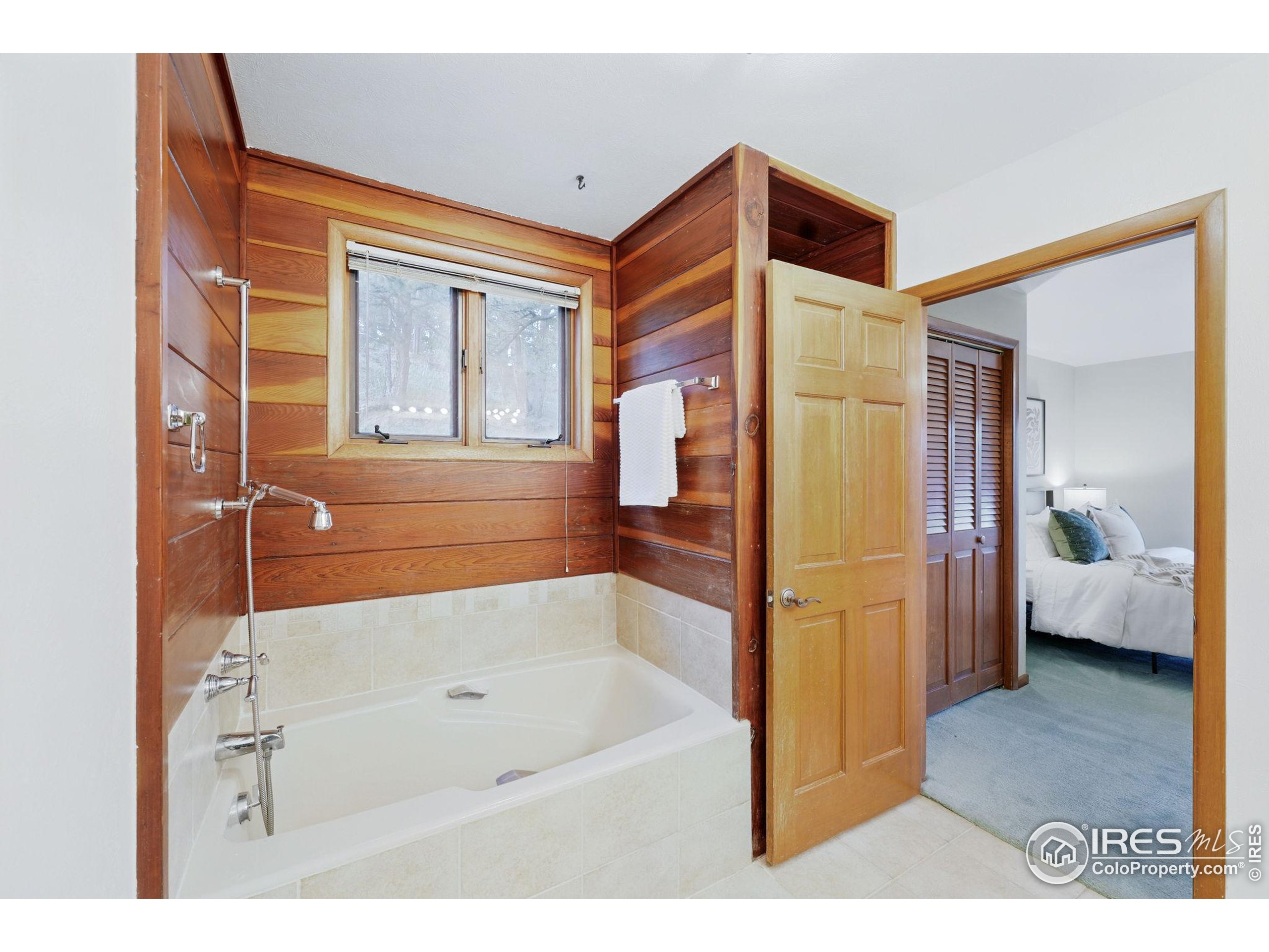 1101 Peakview Circle Boulder, CO 80302 - Photo 22 of 37 a bathroom with a bathtub and a shower