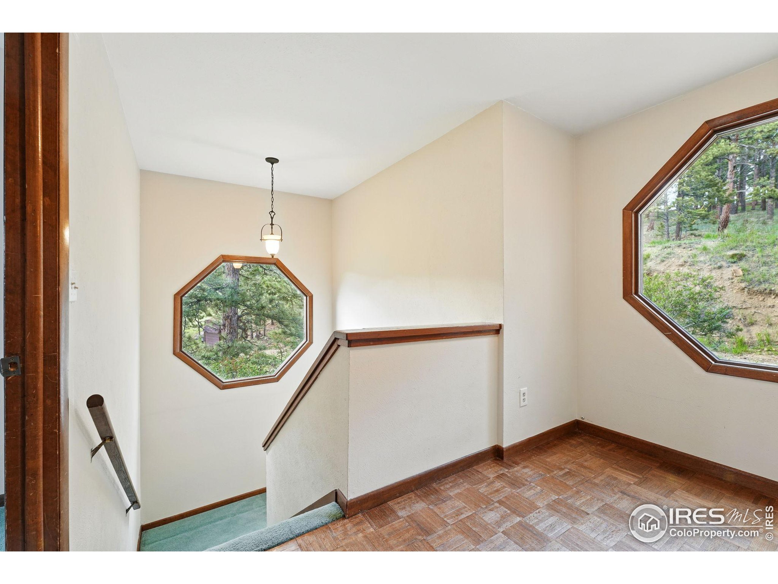 1101 Peakview Circle Boulder, CO 80302 - Photo 24 of 37 a view of an empty room with windows