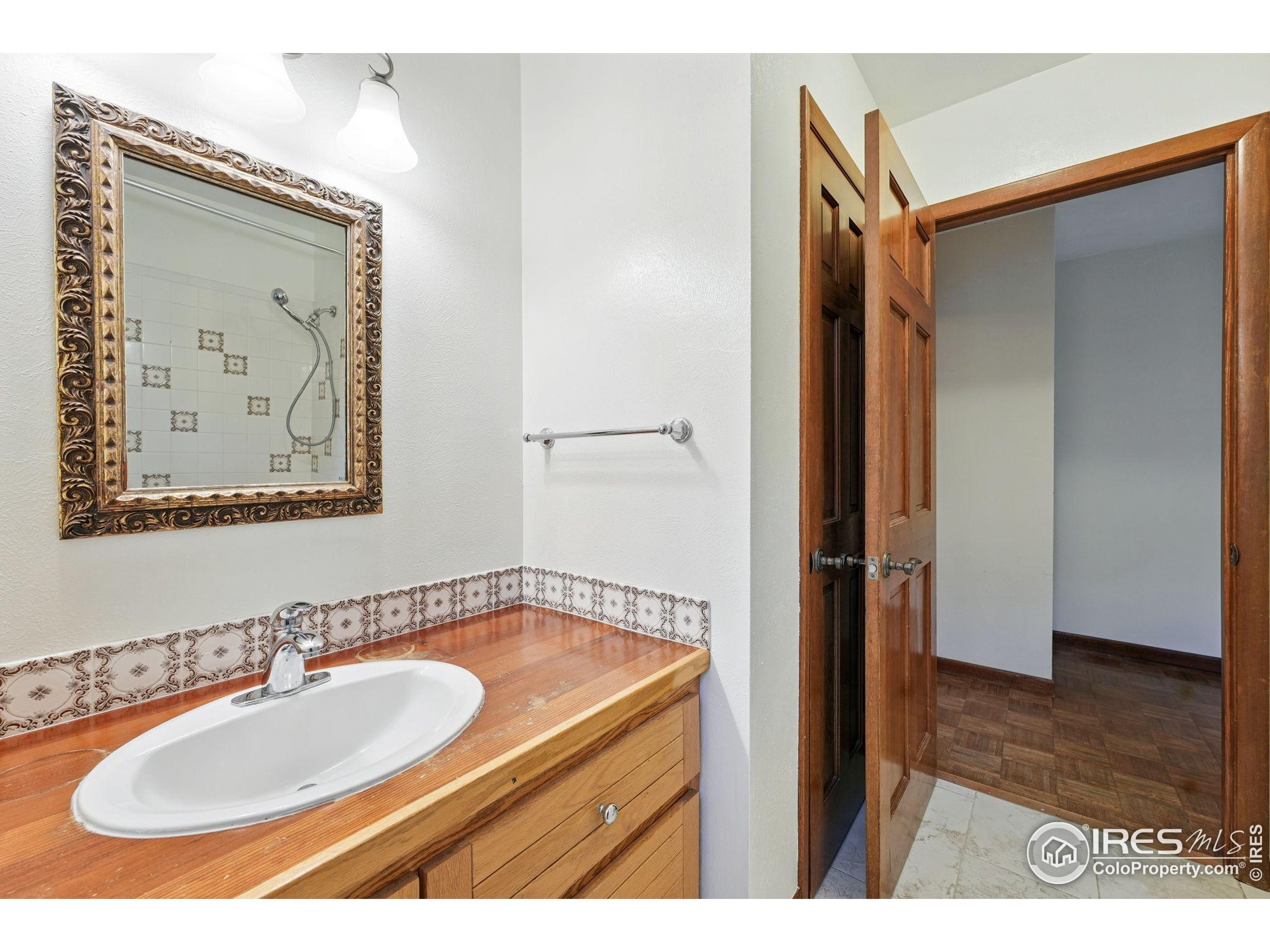 1101 Peakview Circle Boulder, CO 80302 - Photo 27 of 37 a bathroom with a sink and a mirror