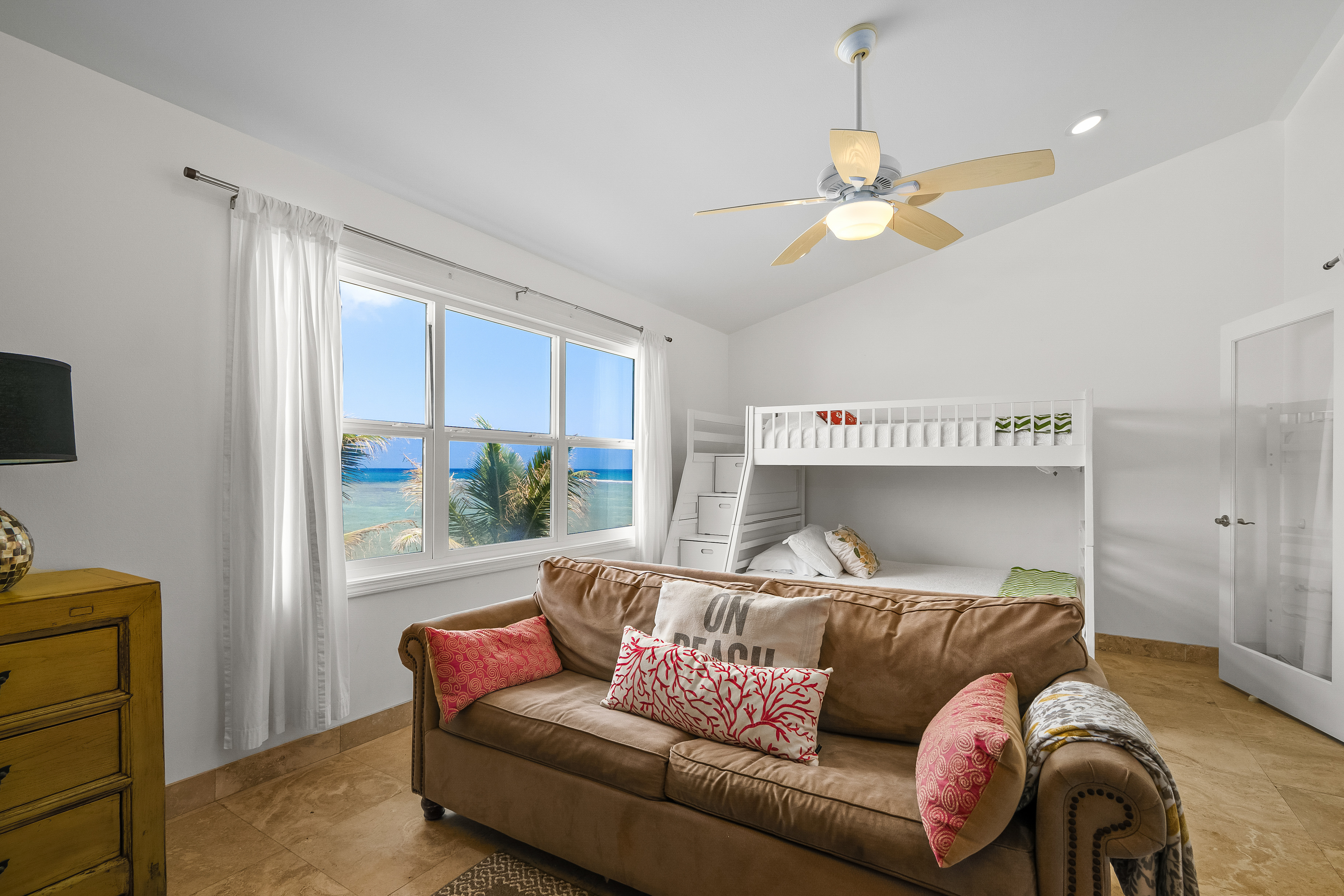 4910 Aliomanu Road Anahola, HI 96703 - Photo 23 of 30 a living room with furniture and a large window